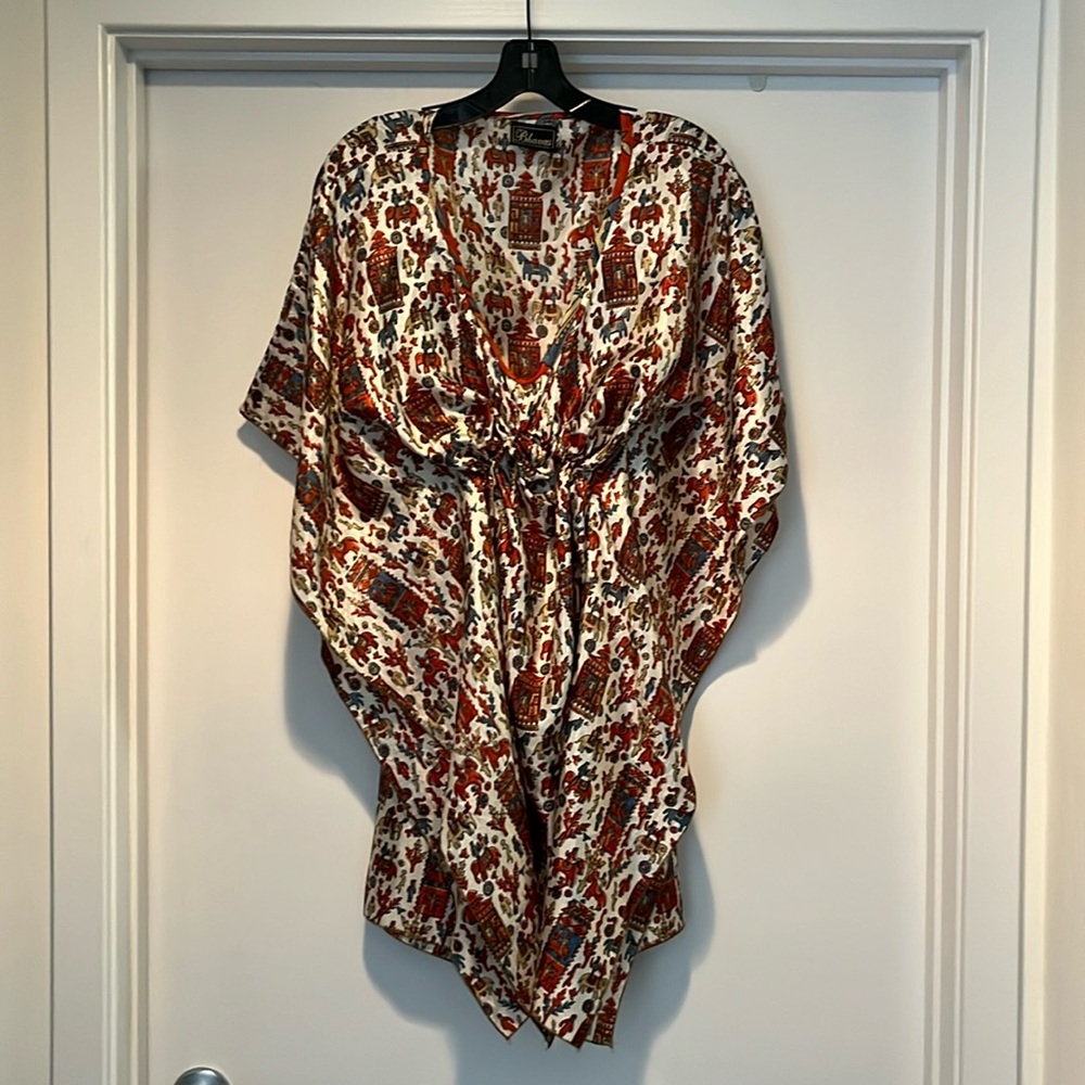 Silk tunic with tie hidden construction detail.